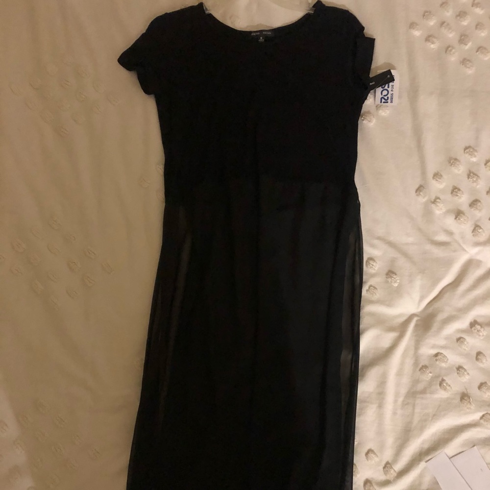 Black cropped blouse with long sheer panels.